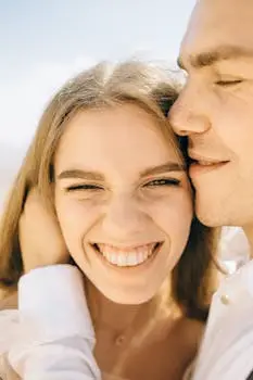 Joyful close-up of a smiling couple enjoying the outdoors together.
